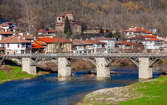 Yantra river with stone bridge and a Veliko Tarnovo town