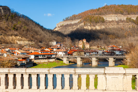 Yantra river with stone bridge and a Veliko Tarnovo town